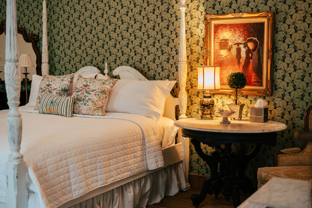 A view of the bed and lamp of the Shamrock Suite at Inisfree Estate